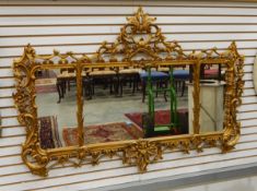 Carved giltwood overmantel wall mirror, rectangular and in three sections,