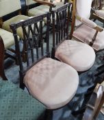 Two Victorian mahogany framed balloon-back dining chairs on turned supports