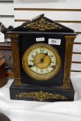 Late Victorian black slate mantel clock with brass mounts, enamel chapter ring,