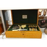 Oak table canteen containing sundry EPNS and yellow-handled table flatware,