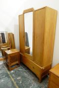 Mid 20th century oak bedroom suite of three pieces viz:- wardrobe with basal drawer,