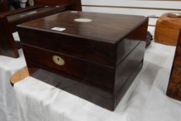 Victorian rosewood writing box with oval mother-of-pearl inlay and side drawer to base,