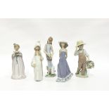 Group of five Lladro porcelain children figures to include flower gatherers, etc.