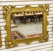 Giltwood rectangular wall mirror of rococo design and an oval cream painted wall mirror with