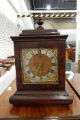 Regency-style mahogany bracket clock with urn finial,