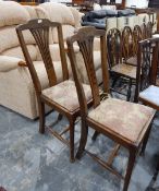 Pair of oak dining chairs, the high backs with pierced splats,