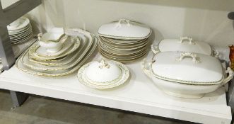 Limoges part dinner service comprising tureens, serving plates, dinner plates, gravy boat etc.