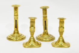 Pair of small early 19th century brass candlesticks of rectangular bases with pushers,