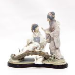 Lladro porcelain figure group of two Japanese geisha girls on a bridge with stork on a plinth base,