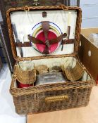 Vintage wickerwork picnic basket with original metal and ceramic sandwich holder and three various
