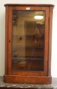 Victorian walnut veneer music cabinet, the glazed panel door enclosing four shelves,