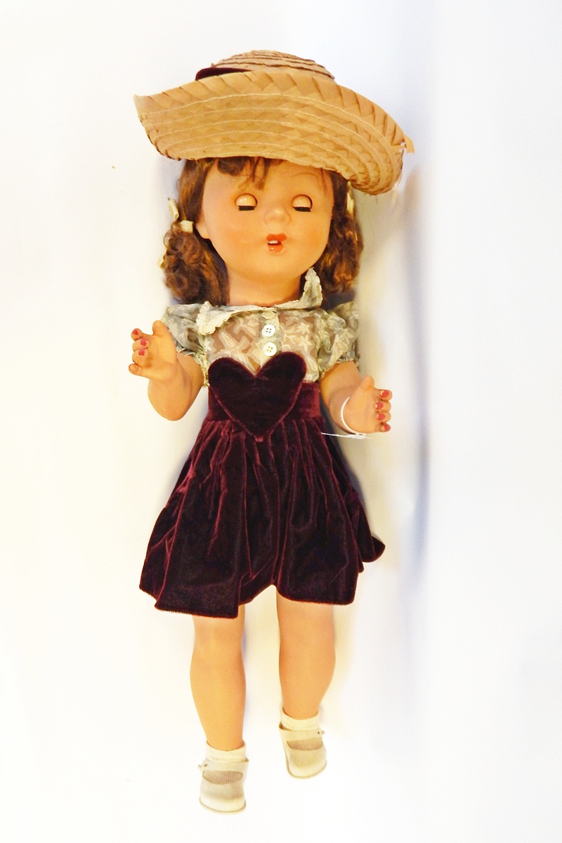Composition walking doll, sleep eyes, open rose bud mouth, brown hair with bunches,