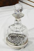 Cut glass and silver-mounted wine decanter with bulbous body and the facet-cut stopper and the