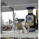 Brass-coloured metal chandelier, a modern freeform metal electrolier, a large ceramic urn,