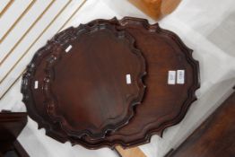 Mahogany oval tray with piecrust border, 58cm and a similar circular tray,