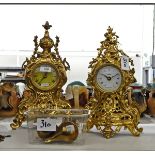 Wood and brass metal wall clock with pendulum and chains and two gilt-coloured metal clocks in