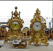 Wood and brass metal wall clock with pendulum and chains and two gilt-coloured metal clocks in