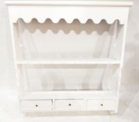 White painted hanging dresser shelves with shaped apron and fitted three small drawers