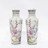 Pair of Oriental porcelain vases, with tall flared necks and circular tapering form,