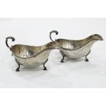 Pair of Georgian style silver sauce boats, each with gadrooned border, double C-scroll handle,