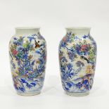 Pair of late 19th/early 20th century Japanese vases of baluster form decorated in blue and white