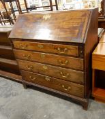 Late 18th/early 19th century mahogany bureau having four graduated long drawers with brass bale