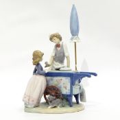 Lladro figure group of an icecream seller, the boy giving an icecream to a girl with puppy,