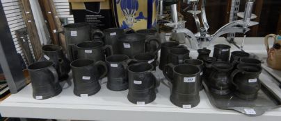Large quantity of pewter tankards and a metal tray