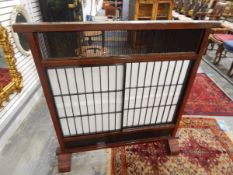 Oriental mahogany framed screen with sliding panels