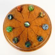 Late 19th/early 20th century circular mahogany game with painted numerals and having indentations