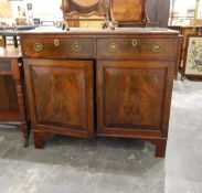 19th century dwarf mahogany side cabinet having two drawers over two field panelled doors,