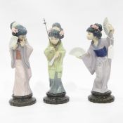 Two Lladro figures of Oriental ladies with fans together with another raised on a socle base (3)