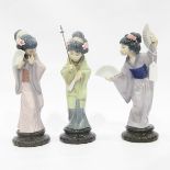 Two Lladro figures of Oriental ladies with fans together with another raised on a socle base (3)