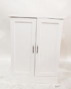White painted dwarf two-door cupboard, 65cm wide,