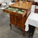 Pair of mahogany cabinets and contents of plated cutlery,