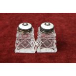 Pair of Norwegian silver, cut glass and enamel miniature salt shakers of square tapered form,
