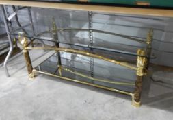 Glass topped coffee table with faux marble supports and brass-coloured metal,