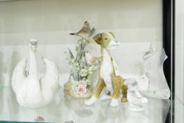 Lladro figure of a swan, two dog models,