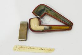 Meerschaum pipe with silver collar, a letter opener, a Dunhill lighter,