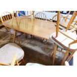 Ercol elm and beech dining table and chairs,