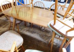 Ercol elm and beech dining table and chairs,