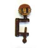 Victorian Tunbridgeware sewing clamp with geometric decoration surmounted by a circular pincushion