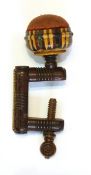 Victorian Tunbridgeware sewing clamp with geometric decoration surmounted by a circular pincushion