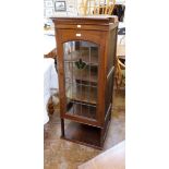 Arts & Crafts style oak corner display cabinet having four shelves enclosed by leaded and stained