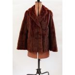 Two squirrel fur jackets, one dyed deep chestnut colour,