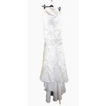 White satin strapless full-length wedding dress embroidered with silver thread and sequins,