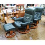 Pair of Ekornes leather revolving and reclining armchairs and matching footstools in dark green