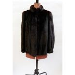 Dark ranch mink three-quarter length jacket with mandarin collar and cuffs to the sleeves,