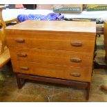 Mid 20th century G-Plan chest of three drawers with figured bar handles, on curved supports,