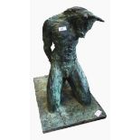 Bronze effect sculpture of a kneeling Minotaur, his hands behind him, on rectangular base, unsigned,